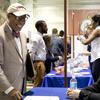 Mike Robinson, Director of Tempe's Community Hiring Initiative, talking with employers at Temple's job fair.